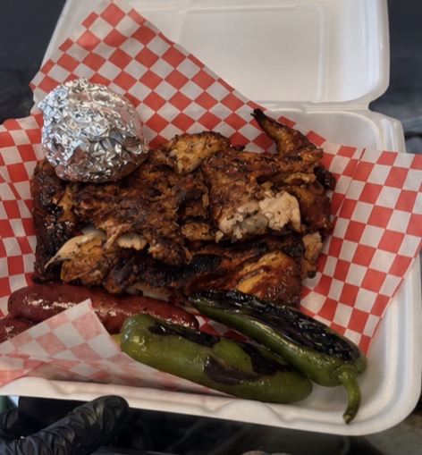 Takeout box with grilled chicken, sausage and charred jalapeños